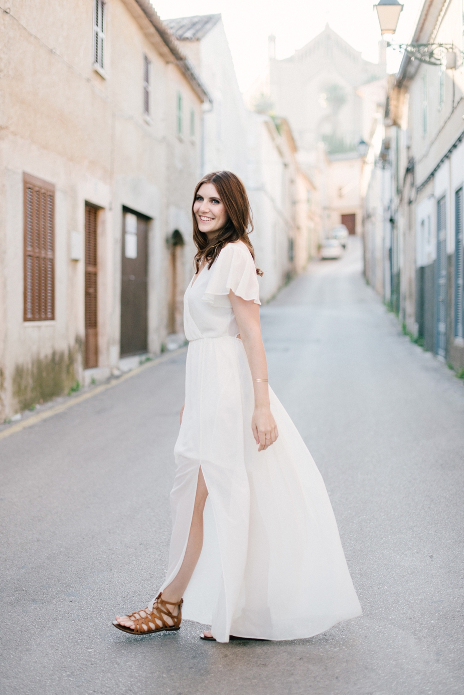 beautiful woman in maxi dress in the streets of Mallorca