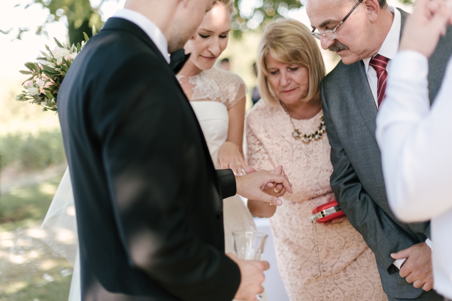 wedding guests admiring wedding ring at Bastide de Marie wedding