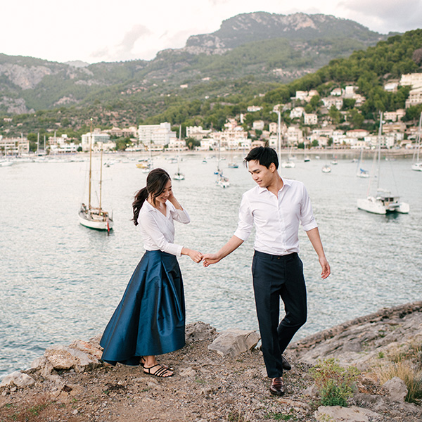 oceanside honeymoon couple session with korean couple at port de soller in mallorca by maria hibbs